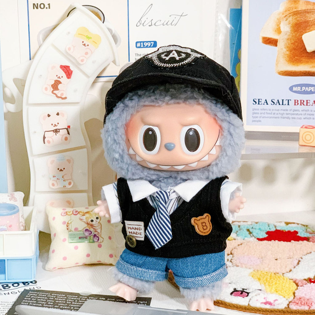 Black preppy vest outfit styled on a 10cm plush