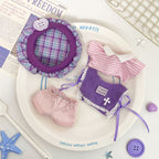 Purple artist outfit set with plaid beret, striped top, sweater vest, and shorts