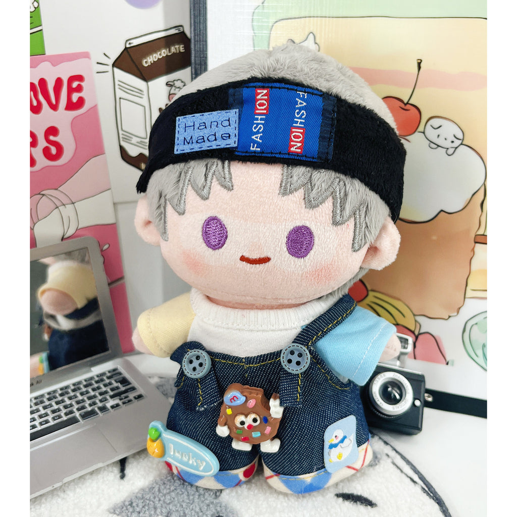 Close-up of black plush headband and denim patchwork overalls for 10cm plush