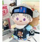 Close-up of black plush headband and denim patchwork overalls for 10cm plush